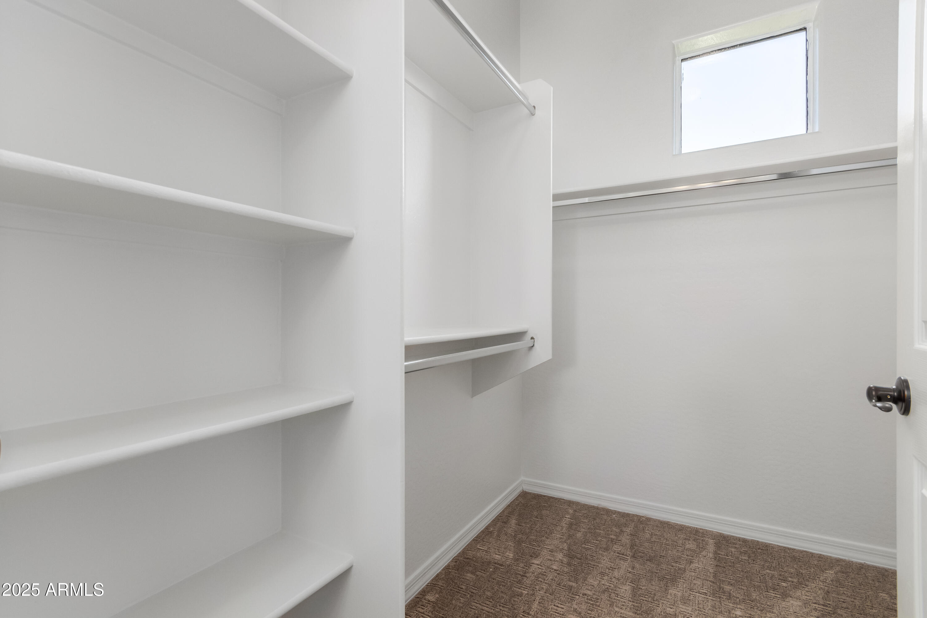 3330 South Gilbert Road, Unit 2018 Chandler, AZ 85286 - Photo 18 of 24 a view of an empty walk in closet