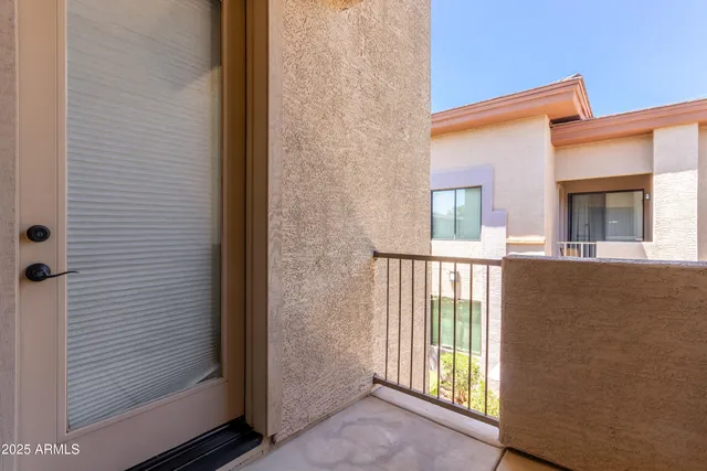 a view of a balcony and an entryway