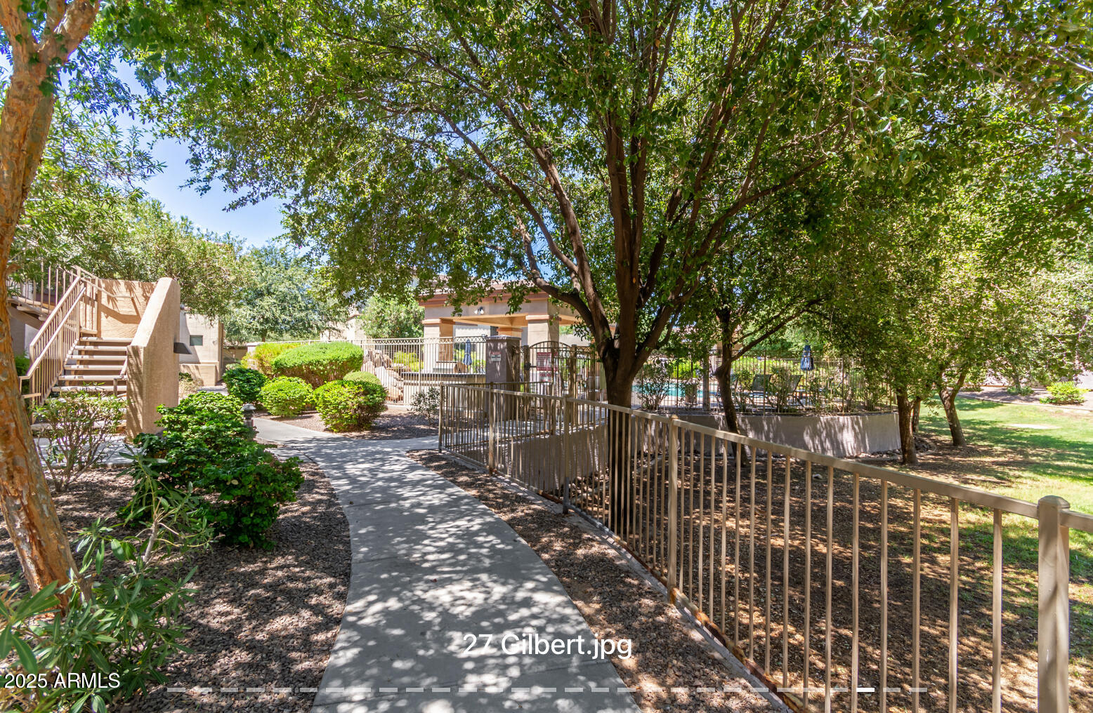 3330 South Gilbert Road, Unit 2018 Chandler, AZ 85286 - Photo 22 of 24 a view of a pathway with a wrought fence
