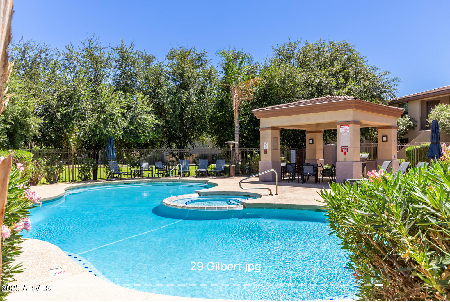 3330 South Gilbert Road, Unit 2018 Chandler, AZ 85286 - Photo 23 of 24 a view of a house with swimming pool and sitting area