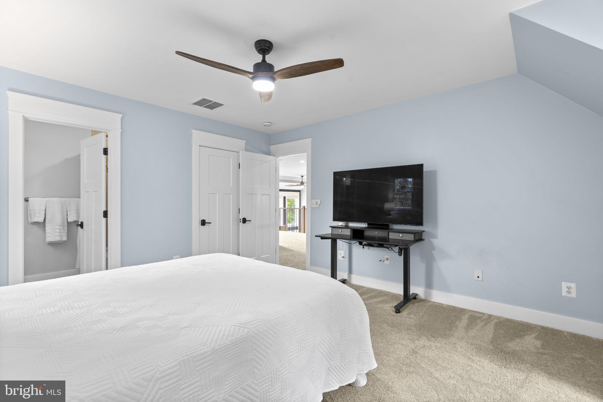798 Creek View Road Severna Park, MD 21146 - Photo 33 of 72 a bedroom with a bed and a flat screen tv