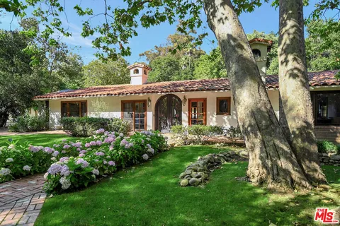 a view of a house with a garden