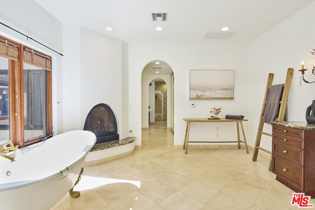 6138 Ramirez Canyon Road Malibu, CA 90265 - Photo 13 of 31 a living room with furniture bathtub and a flat screen tv