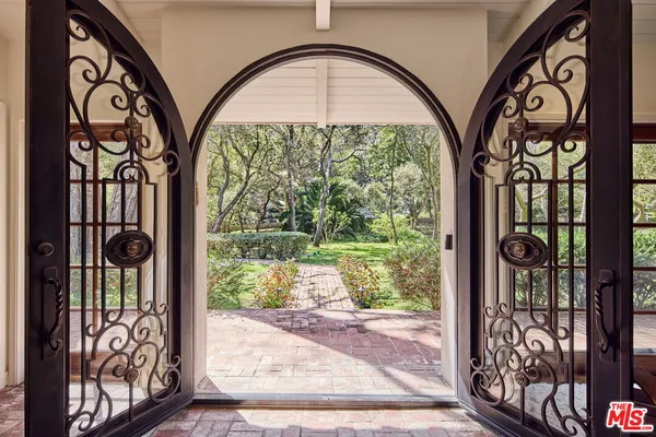 a view of entryway with a front door and wooden floor