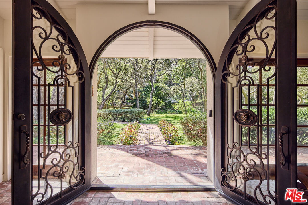 6138 Ramirez Canyon Road Malibu, CA 90265 - Photo 3 of 31 a view of entryway with a front door and wooden floor