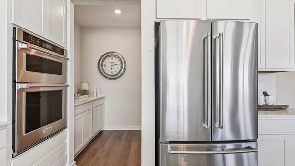 a view of washer and dryer with wooden floor
