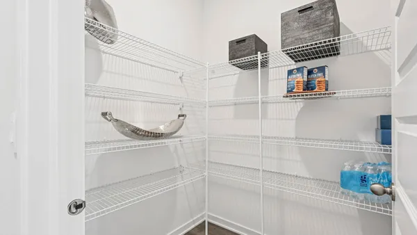 a kitchen with stainless steel appliances granite countertop white cabinets and a stove