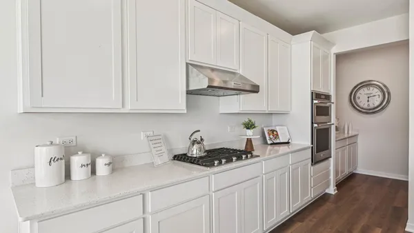 a kitchen with a sink and refrigerator