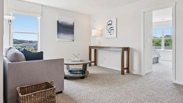 a bed room with a bed and a chair