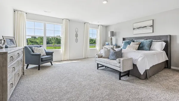 a bathroom with double vanity sinks a mirror and a shower
