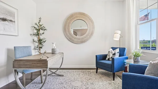 a living room with furniture a table and decor