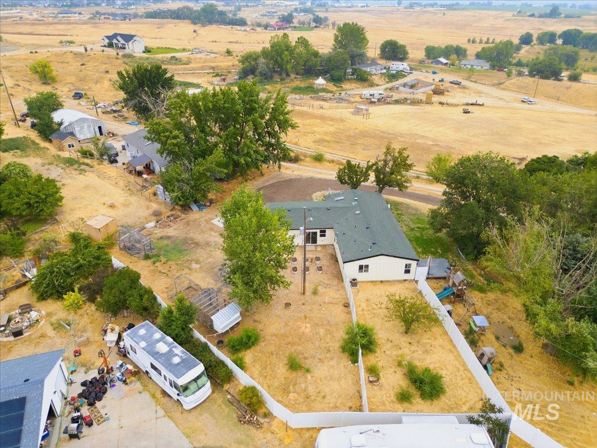 17114 Goodson Road Caldwell, ID 83607 - Photo 43 of 47 Single-story residence with a dark green roof and light-colored siding
