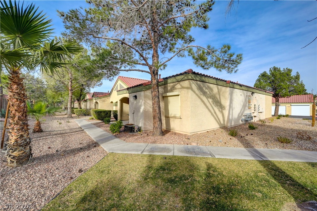 7885 West Flamingo Road, Unit 1071 Las Vegas, NV 89147 - Photo 4 of 28 A desert-inspired landscape provides a harmonious setting for this inviting exterior.