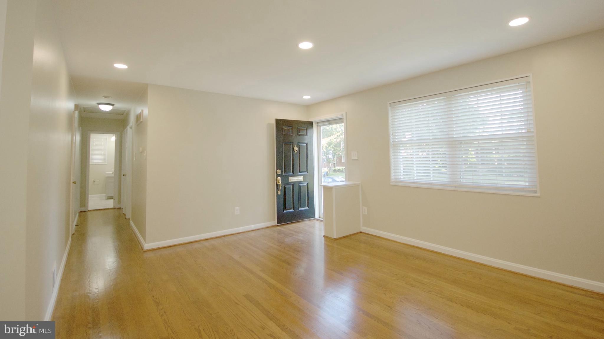 4715 Oxbow Road Rockville, MD 20852 - Photo 6 of 36 Living Room, Front Door and Hallway