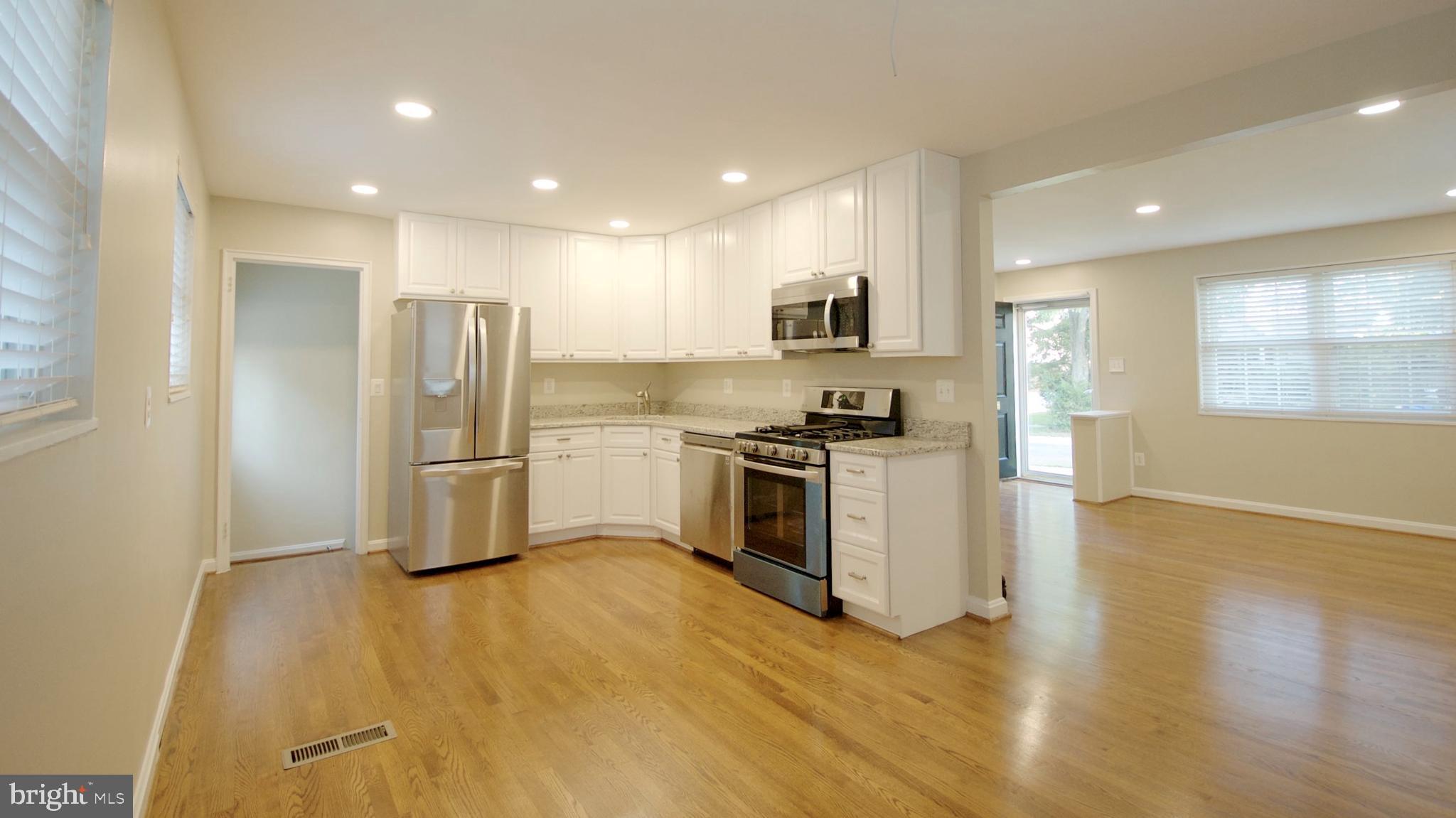 4715 Oxbow Road Rockville, MD 20852 - Photo 10 of 36 Kitchen, Front and Back Doors from Dining Room