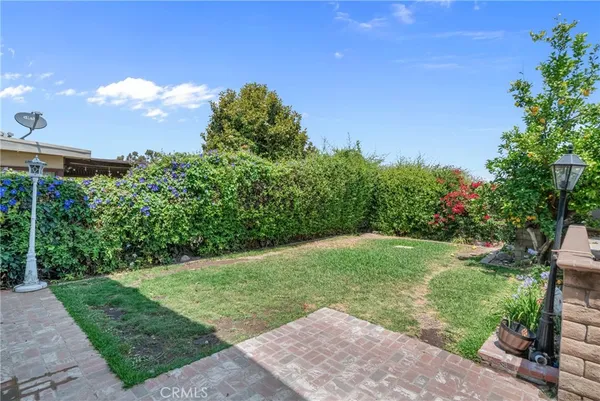 a view of a backyard with sitting area
