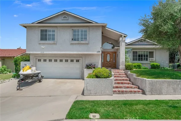 a house view with a garden space