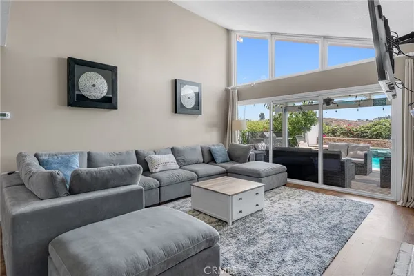a living room with furniture and a rug