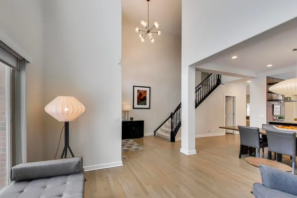 a view of a livingroom with furniture and stairs