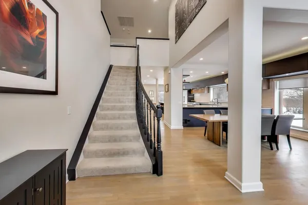 a view of entryway and hall with wooden floor
