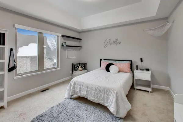 a bedroom with a bed and window