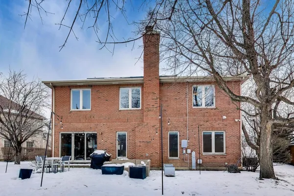 a front view of a house with yard and seating space