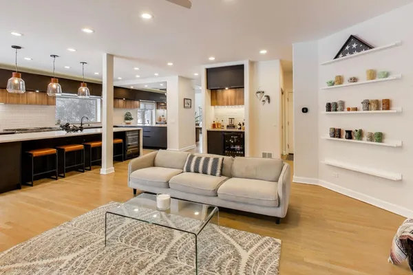 a living room with furniture or kitchen and a fireplace