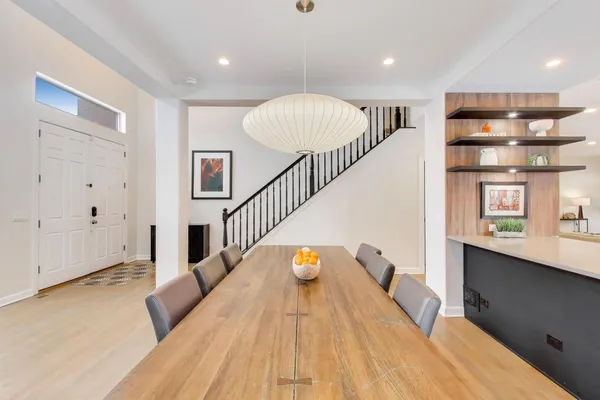 a view of entryway and hall with wooden floor