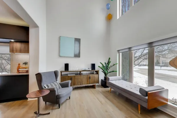 a living room with furniture and a large window