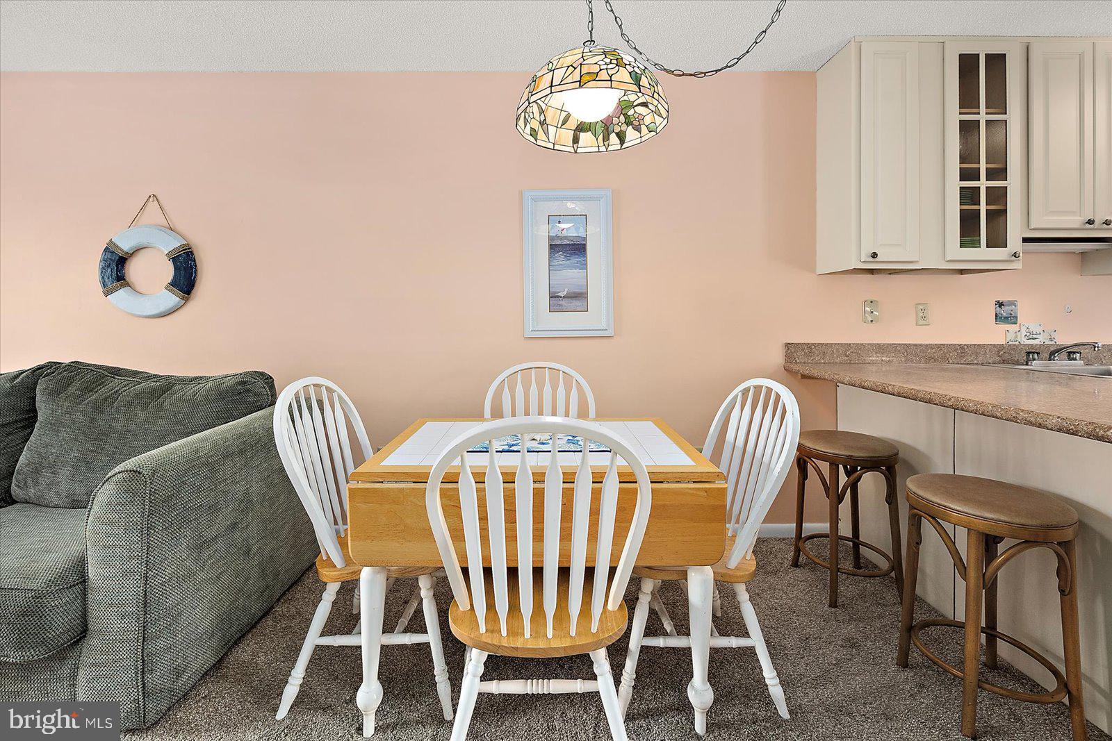 614 Osprey Road, Unit D Ocean City, MD 21842 - Photo 17 of 60 a view of a dining room with furniture