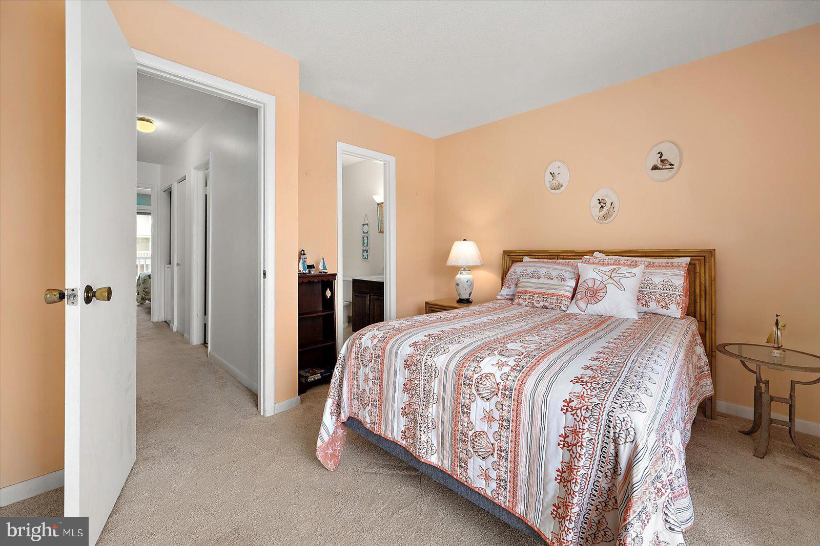 614 Osprey Road, Unit D Ocean City, MD 21842 - Photo 21 of 60 a bedroom with a bed and a refrigerator