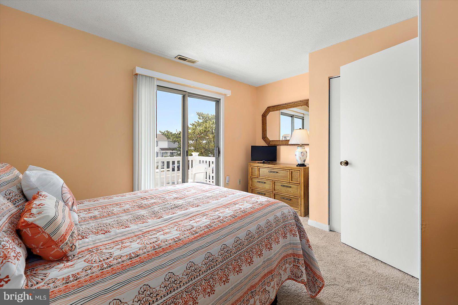 614 Osprey Road, Unit D Ocean City, MD 21842 - Photo 22 of 60 a bedroom with a bed and a window