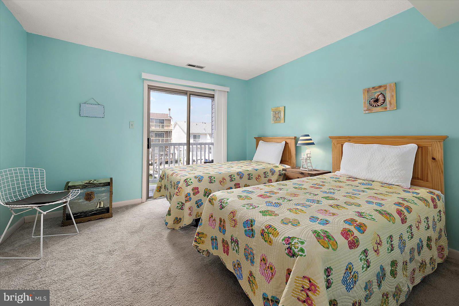 614 Osprey Road, Unit D Ocean City, MD 21842 - Photo 26 of 60 a bedroom with a bed and a window