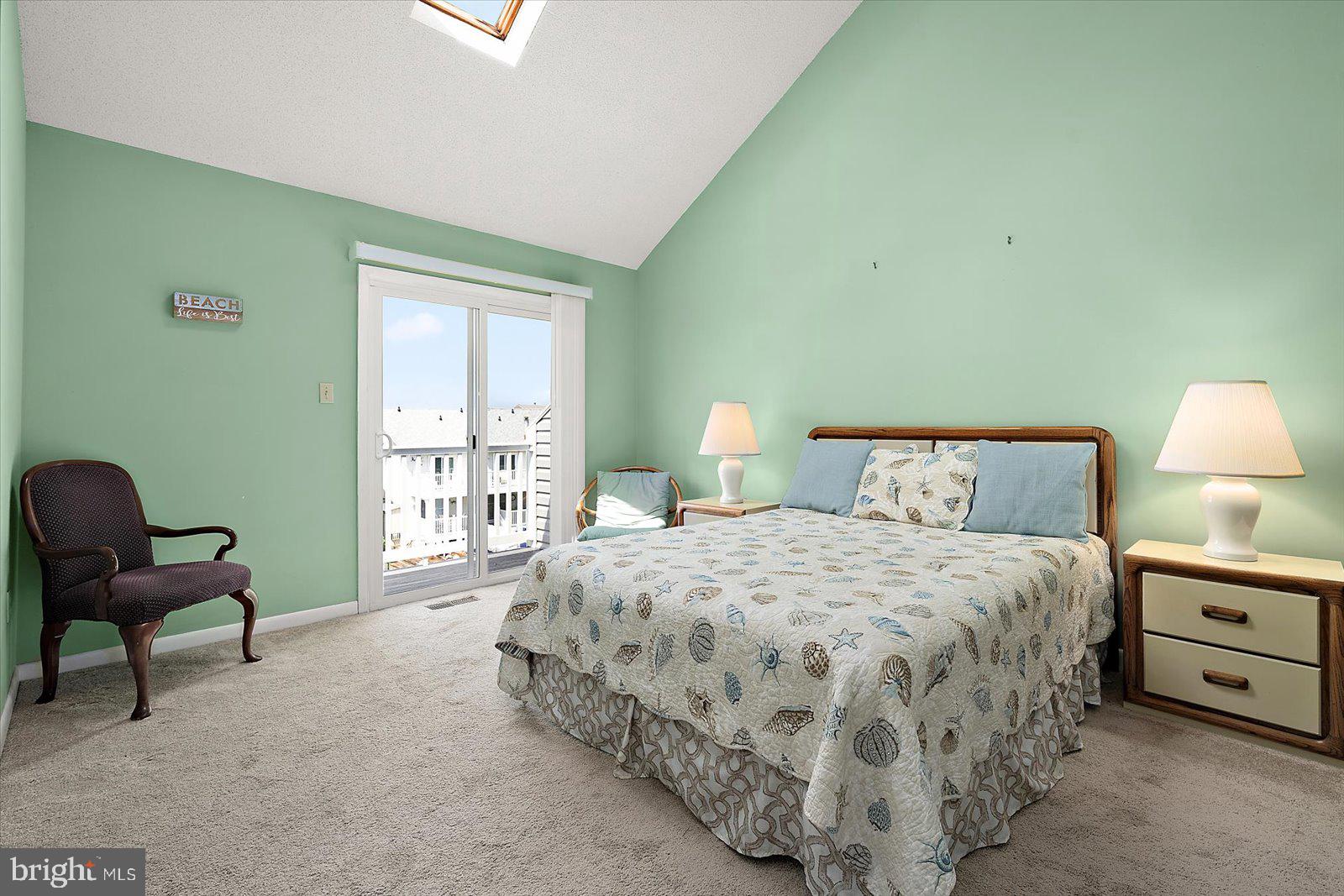 614 Osprey Road, Unit D Ocean City, MD 21842 - Photo 31 of 60 a bedroom with a bed chair and a window