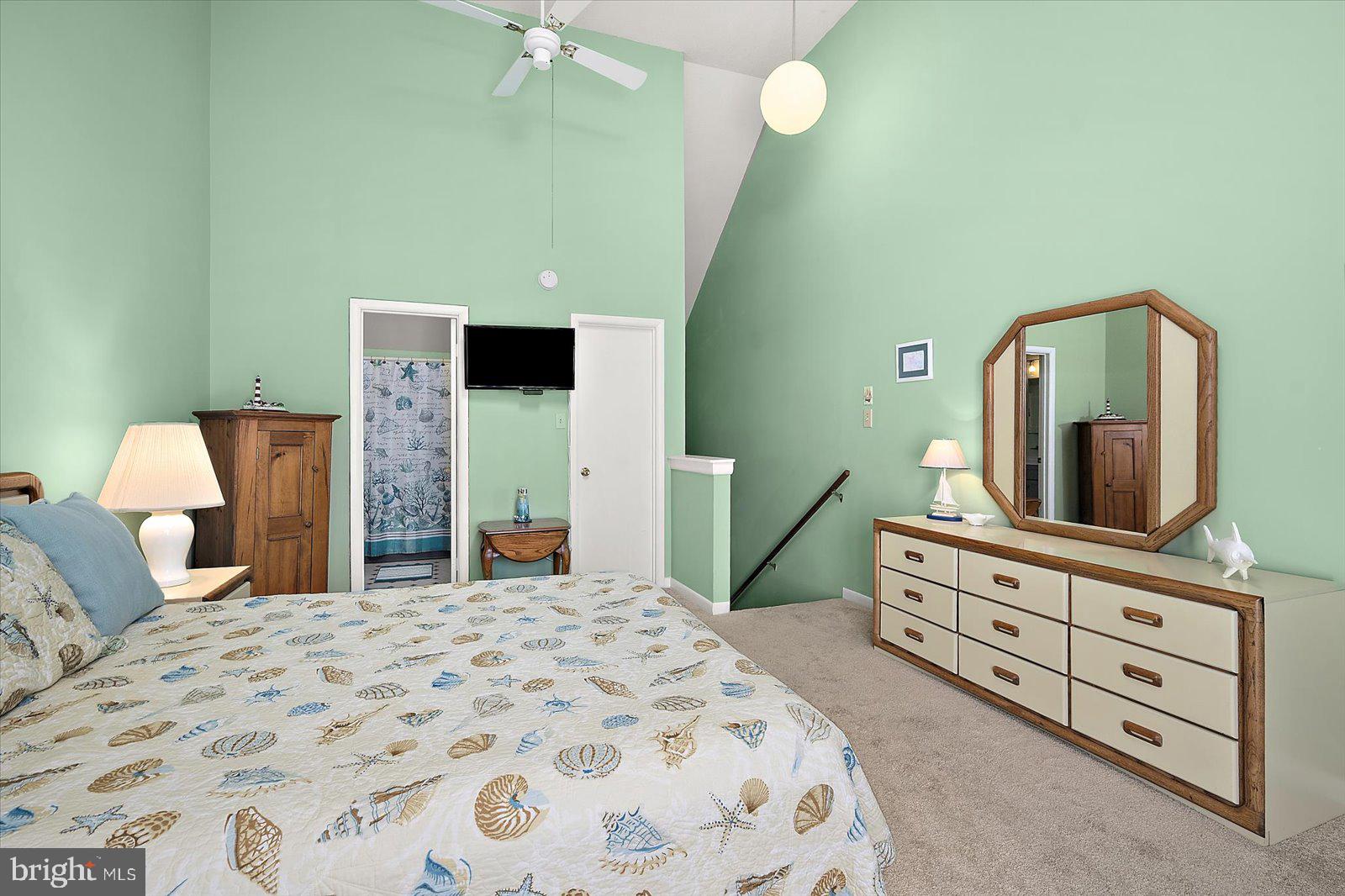 614 Osprey Road, Unit D Ocean City, MD 21842 - Photo 34 of 60 a bedroom with a bed and a dresser