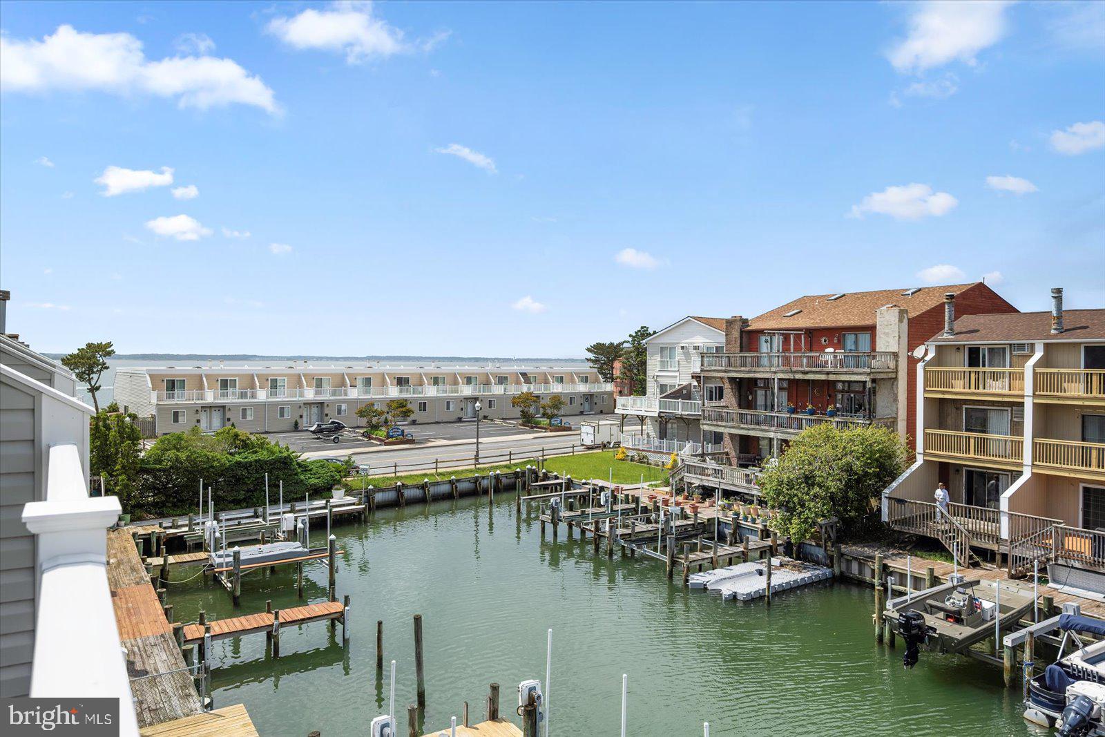 614 Osprey Road, Unit D Ocean City, MD 21842 - Photo 40 of 60 a view of a lake with a city