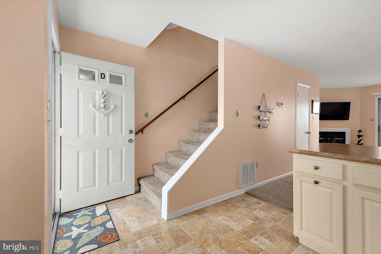 614 Osprey Road, Unit D Ocean City, MD 21842 - Photo 4 of 60 a view of a hallway with workspace and entryway
