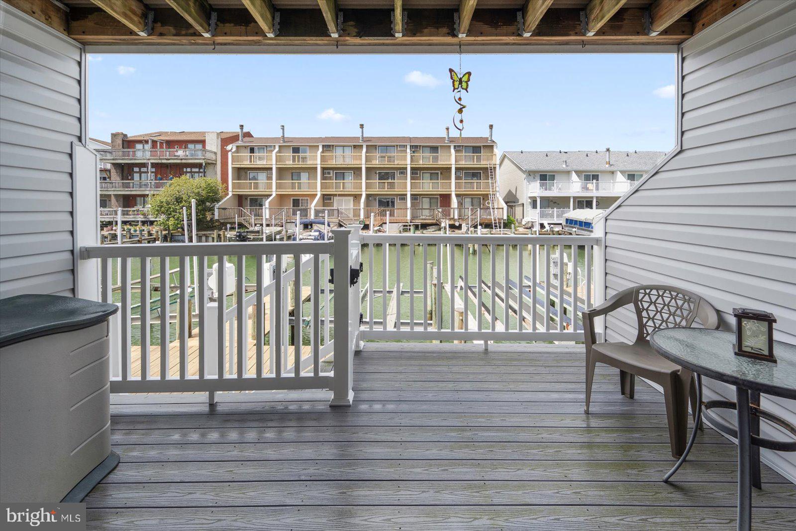 614 Osprey Road, Unit D Ocean City, MD 21842 - Photo 47 of 60 a view of a balcony with chairs
