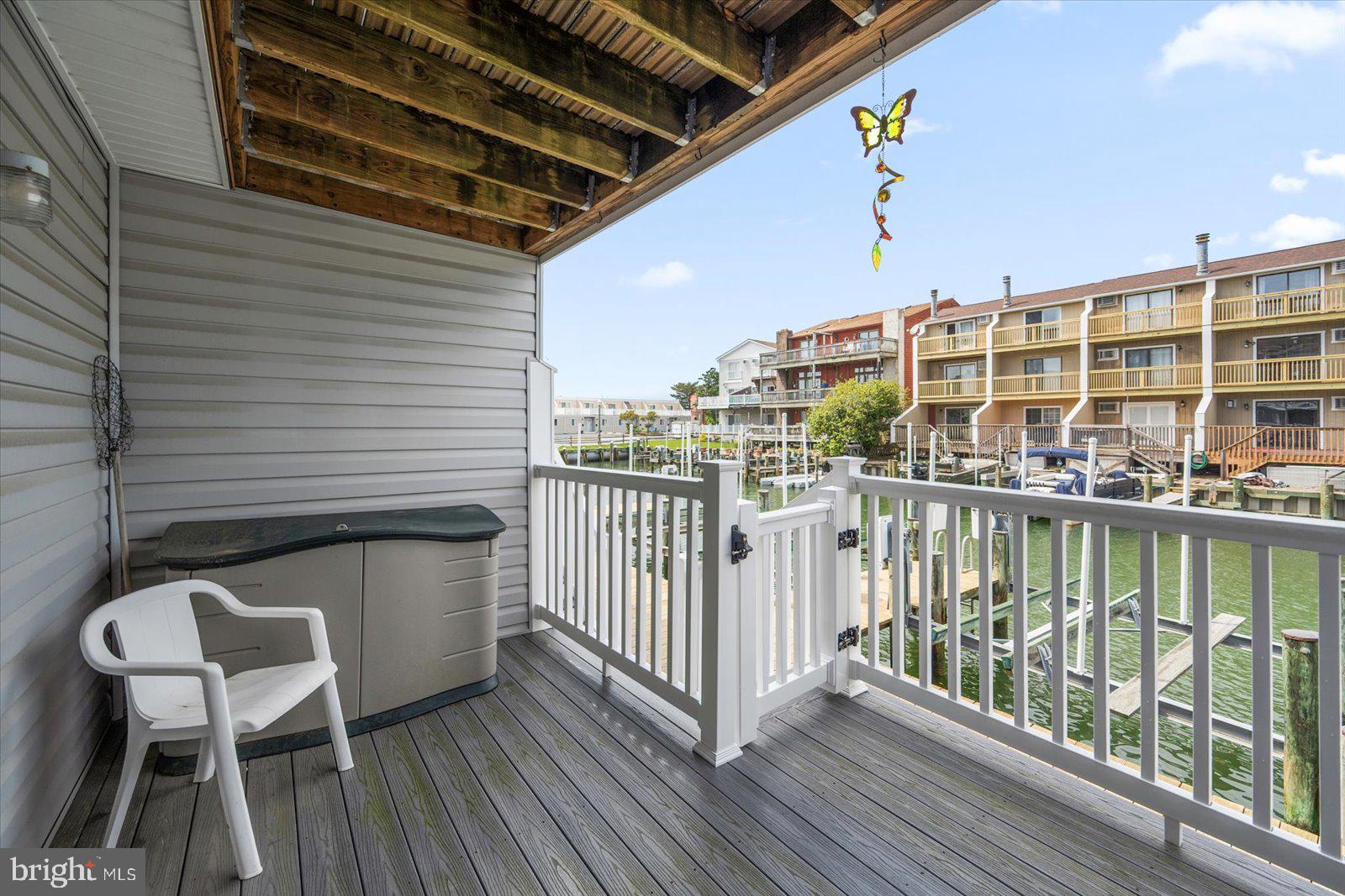 614 Osprey Road, Unit D Ocean City, MD 21842 - Photo 49 of 60 a view of a balcony with chairs