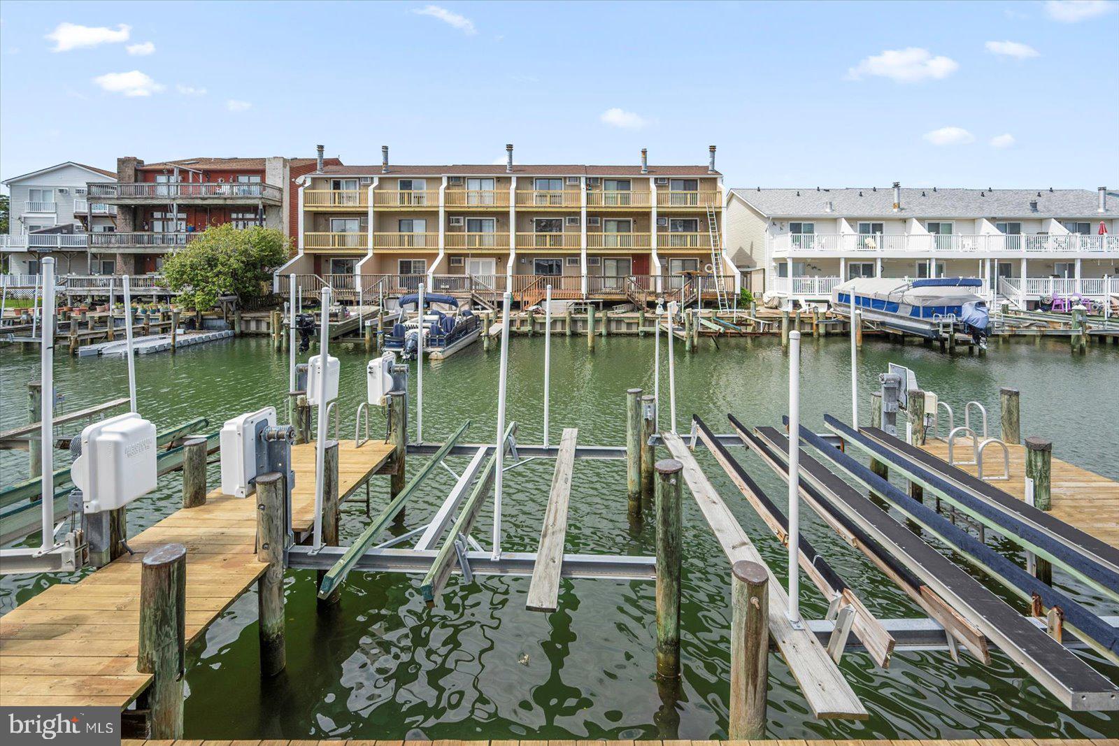 614 Osprey Road, Unit D Ocean City, MD 21842 - Photo 51 of 60 a view of a lake with a building and outdoor view