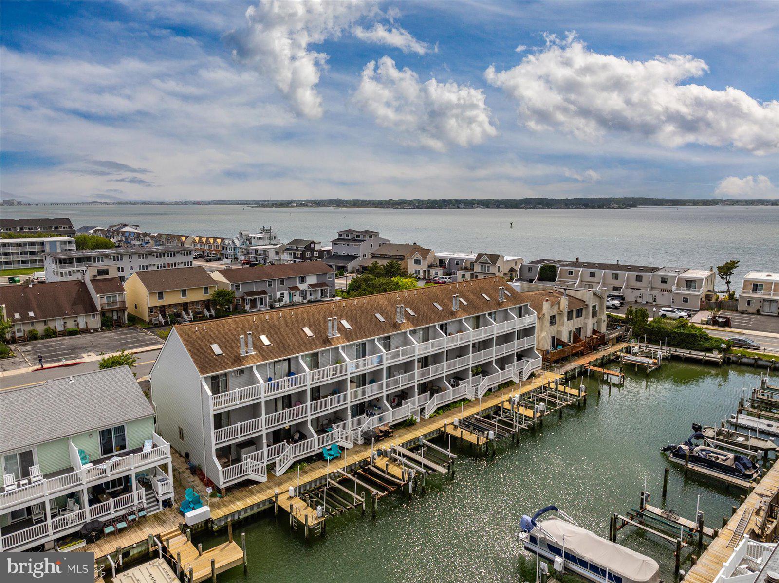 614 Osprey Road, Unit D Ocean City, MD 21842 - Photo 54 of 60 a view of a city with lawn chairs