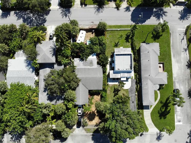 an aerial view of a house with a yard and a garden