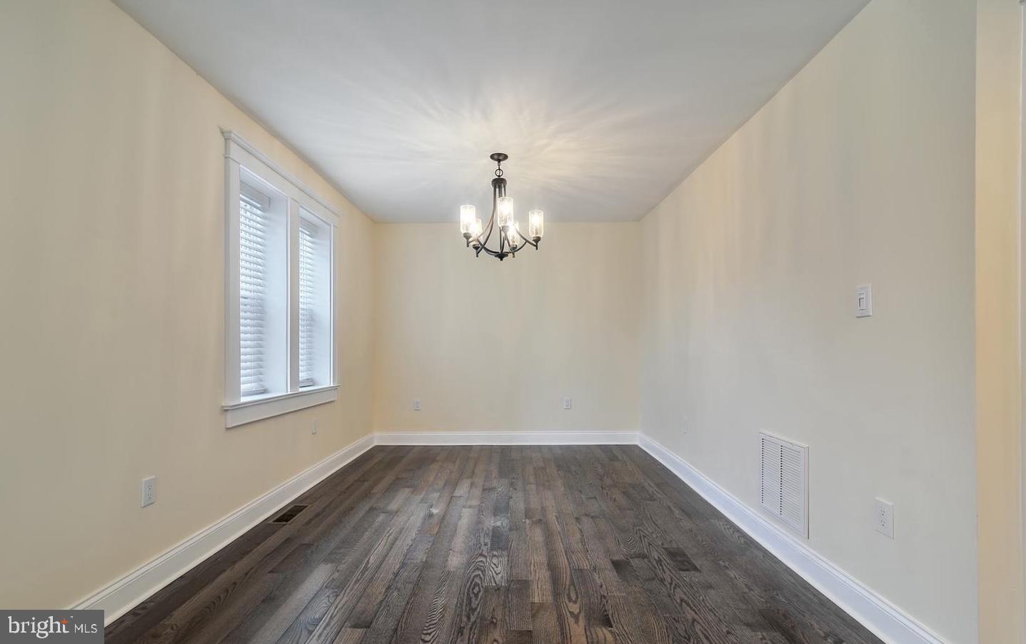 14161 Union Street Milton, DE 19968 - Photo 11 of 31 wooden floor in an empty room with a window