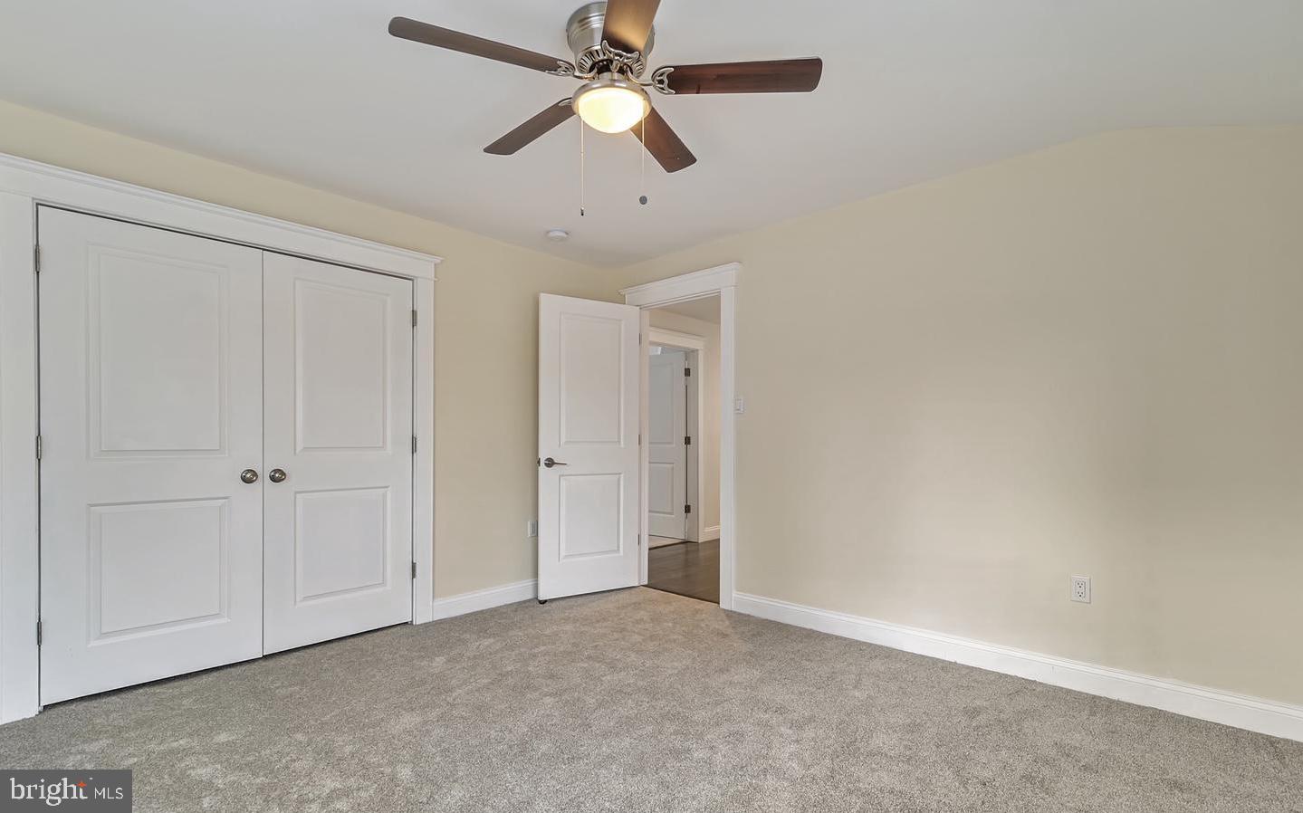 14161 Union Street Milton, DE 19968 - Photo 20 of 31 an empty room with closet and a chandelier fan