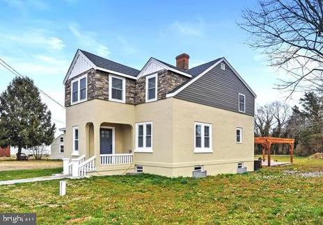 14161 Union Street Milton, DE 19968 - Photo 2 of 31 a front view of a house with a yard
