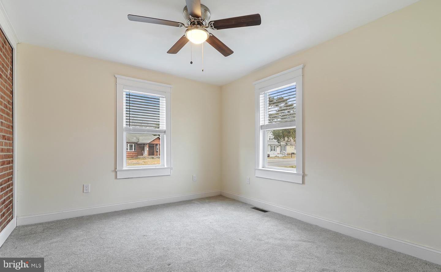 14161 Union Street Milton, DE 19968 - Photo 24 of 31 an empty room with windows and fan