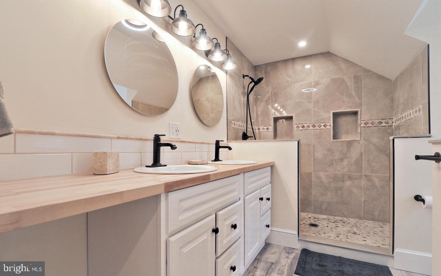 14161 Union Street Milton, DE 19968 - Photo 27 of 31 a bathroom with a double vanity sink mirror and shower