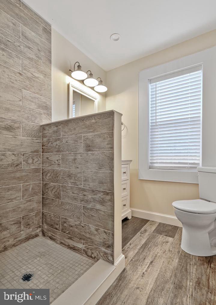 14161 Union Street Milton, DE 19968 - Photo 28 of 31 a bathroom with a toilet and a shower