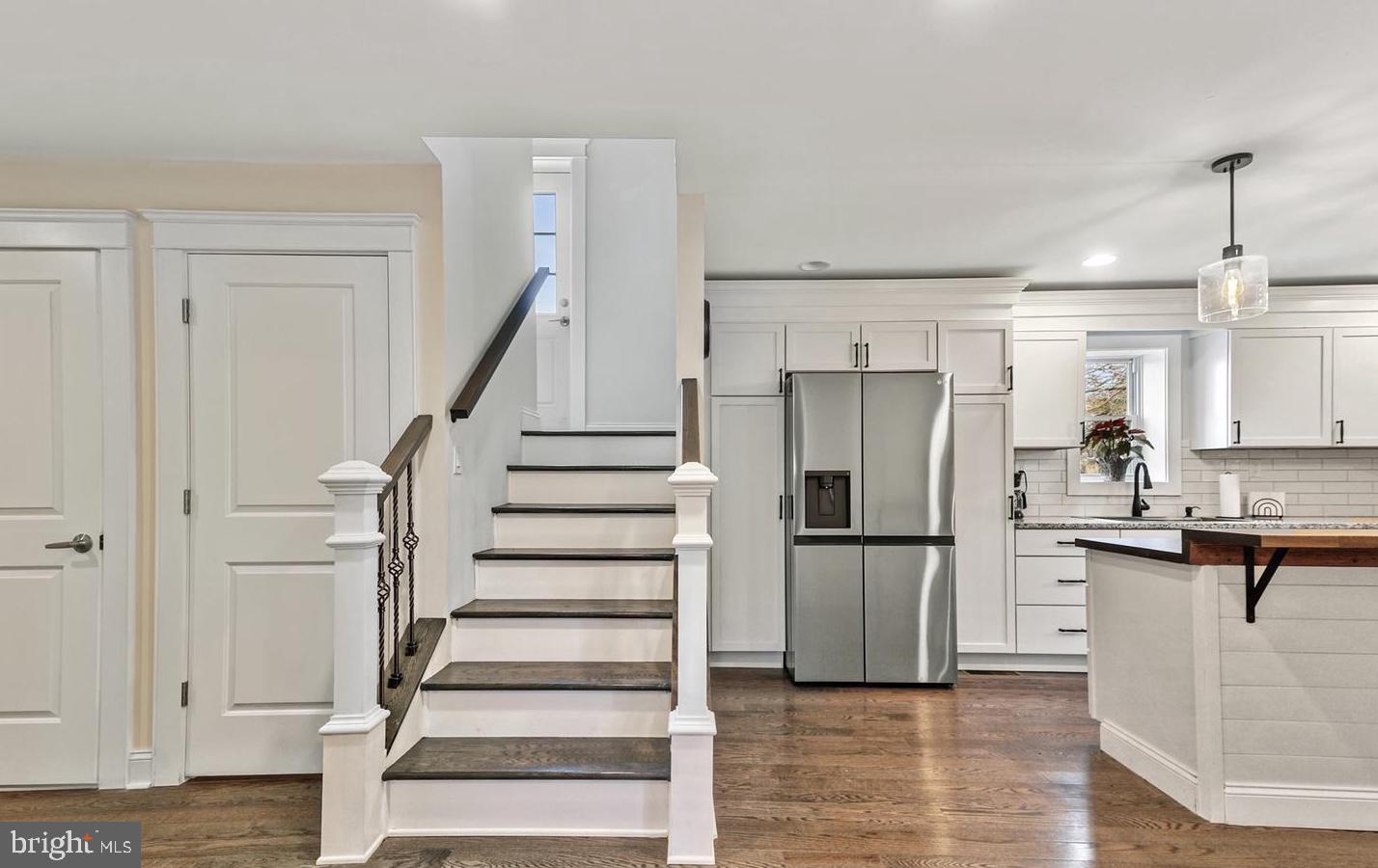 14161 Union Street Milton, DE 19968 - Photo 8 of 31 a kitchen with granite countertop a refrigerator and a stove top oven