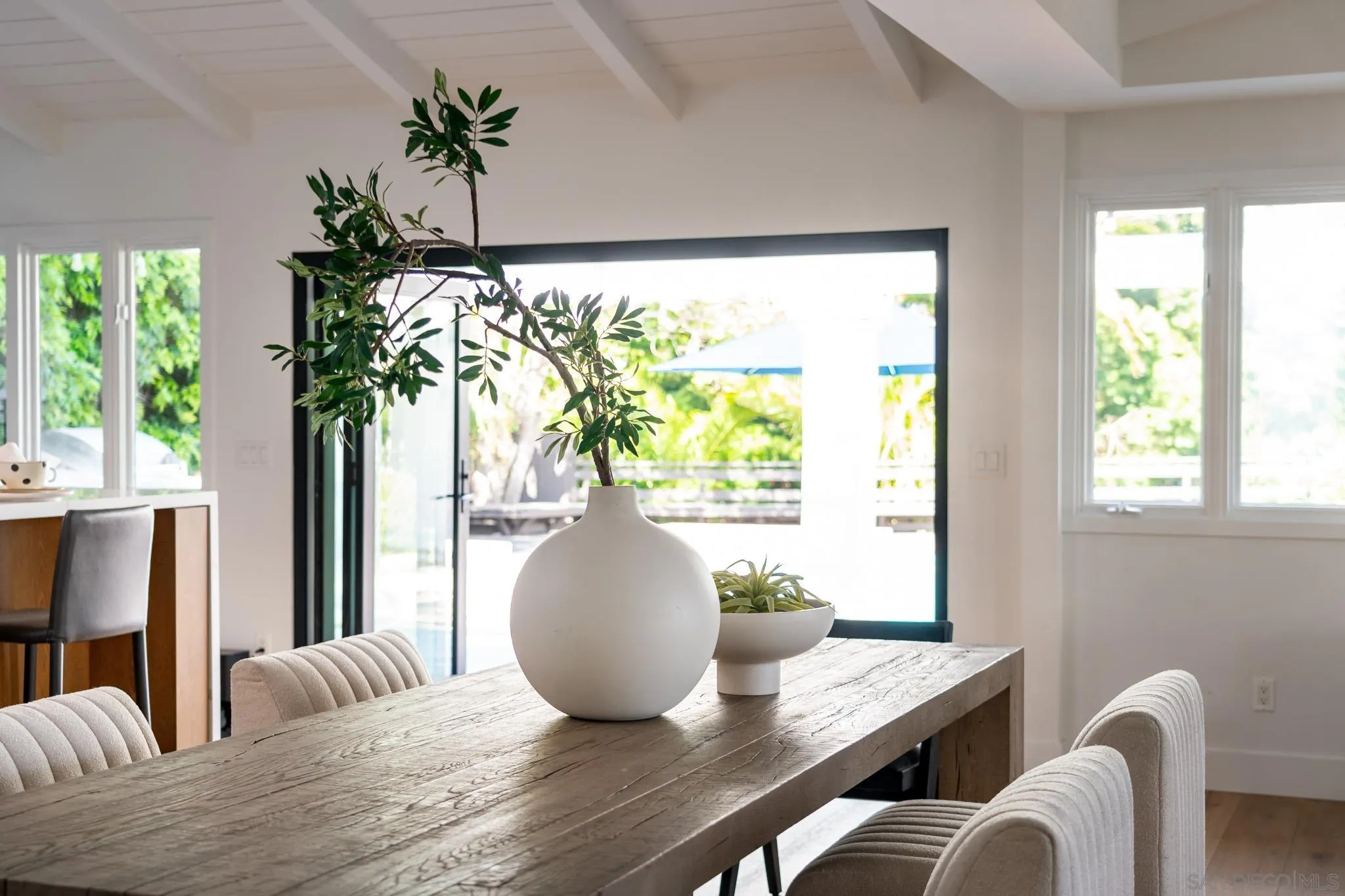 16610 Los Morros Rancho Santa Fe, CA 92067 - Photo 13 of 50 a view of a dining room with furniture window and wooden floor